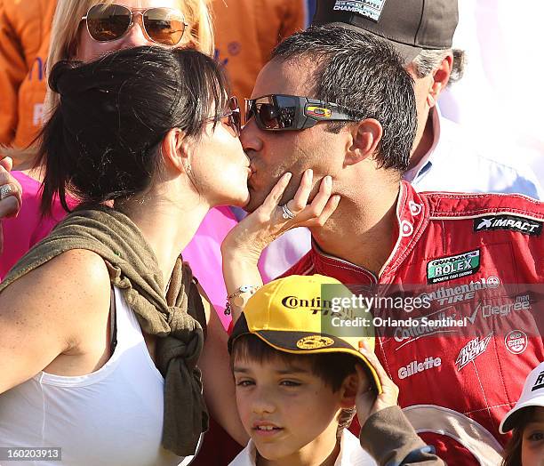 Juan Pablo Montoya, racing for the Chip Ganassi Racing team, gets a kiss as he celebrates in Victory Lane after winning the Rolex 24 Grand-Am race at...