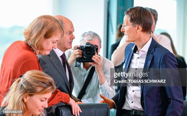 German Minister for Family Affairs, Senior Citizens, Women and Youth Lisa Paus chats with Chancellor Olaf Scholz and Health Minister Karl Lauterbach...