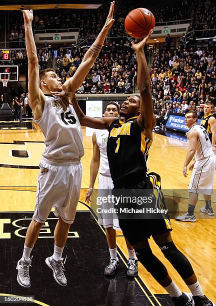 Melsahn Basabe of the Iowa Hawkeyes shoots the ball against Donnie Hale of the Purdue Boilermakers at Mackey Arena on January 27, 2013 in West...