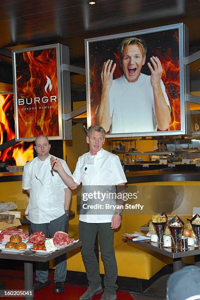 Executive chef Eric Mickle and television personality and chef Gordon Ramsay speak during a traditional Sunday Roast at Gordon Ramsay BurGR at Planet...