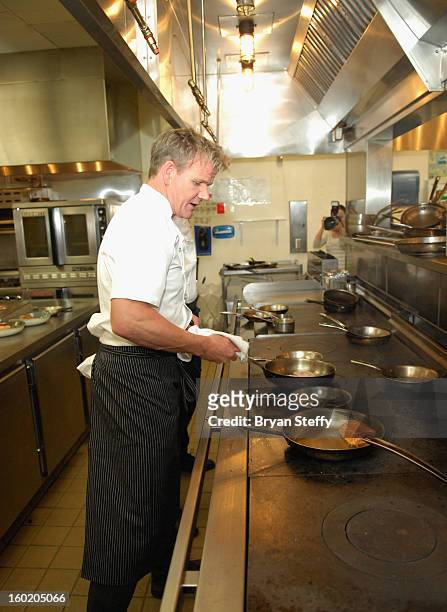 Television personality and chef Gordon Ramsay cooks during a traditional Sunday Roast at Gordon Ramsay Pub & Grill at Caesars Palace in celebration...