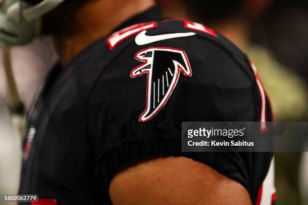 Detail shot of a throwback Atlanta Falcons logo stitched on a jersey prior to an NFL game against the New England Patriots at Mercedes-Benz Stadium...