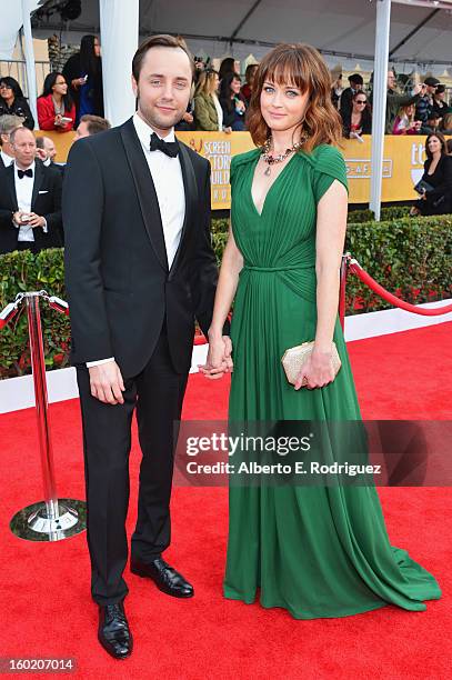 Actors Vincent Kartheiser and Alexis Bledel arrive at the 19th Annual Screen Actors Guild Awards held at The Shrine Auditorium on January 27, 2013 in...