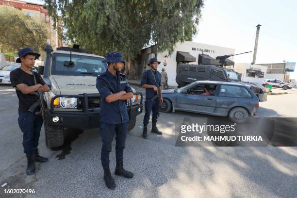 Forces affiliated with the Tripoli-based Government of National Unity deploy following two days of deadly clashes between two rival groups in Libya's...