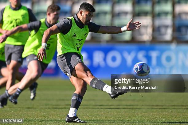 Richie Mo'unga kicks during a New Zealand All Blacks training session at McLean Park on August 09, 2023 in Napier, New Zealand.