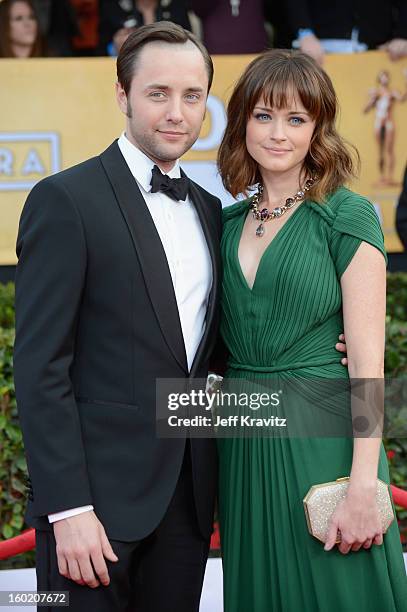 Actors Vincent Kartheiser and Alexis Bledel arrive at the 19th Annual Screen Actors Guild Awards held at The Shrine Auditorium on January 27, 2013 in...