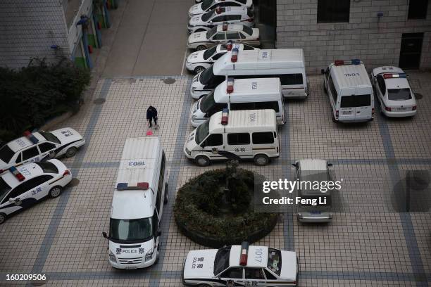 Cleaner works in Guiyang Intermediate People's Court during a press conference on former Chinese leader Bo Xilai's case on January 28, 2013 in...