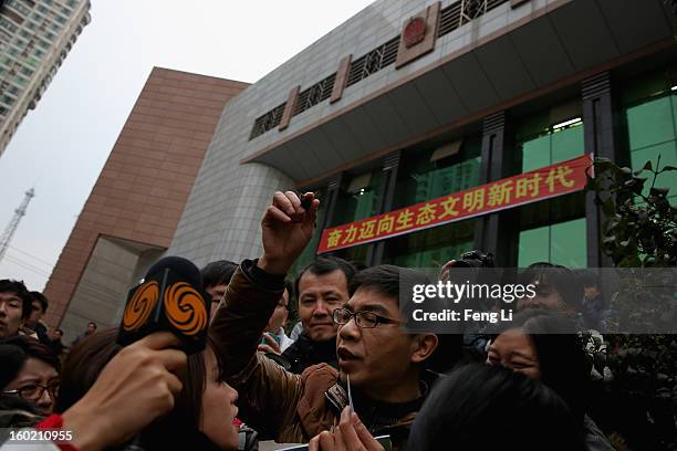 An official of Guiyang Intermediate People's Court leads the media to attend a press conference on former Chinese leader Bo Xilai's case on January...