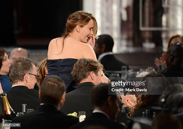 Actress Jennifer Lawrence is congratulated after winning the award for Outstanding Performance by a Female Actor in a Leading Role for 'Silver...