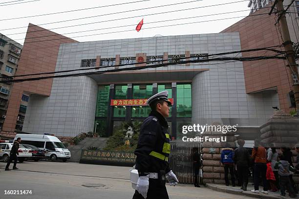 Traffic policeman guards outside Guiyang Intermediate People's Court before a press conference on former Chinese leader Bo Xilai's case on January...