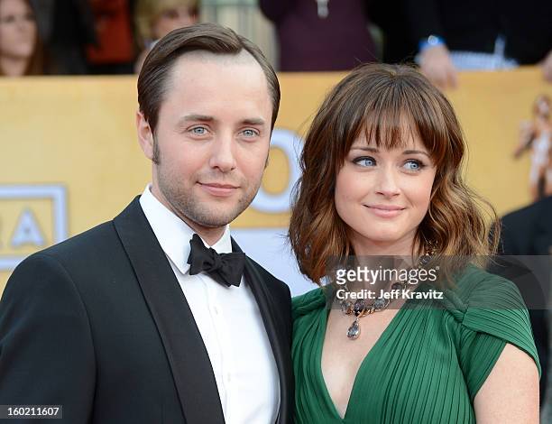 Actors Vincent Kartheiser and Alexis Bledel arrive at the 19th Annual Screen Actors Guild Awards held at The Shrine Auditorium on January 27, 2013 in...