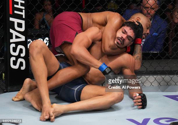 Cesar Almeida of Brazil works for a submission against Lucas Fernando of Brazil in a middleweight fight during Dana White's Contender Series season...