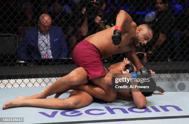 Cesar Almeida of Brazil punches Lucas Fernando of Brazil in a middleweight fight during Dana White's Contender Series season seven, week one at UFC...