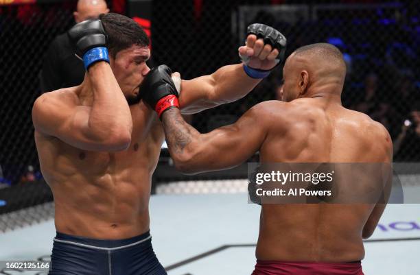 Cesar Almeida of Brazil punches Lucas Fernando of Brazil in a middleweight fight during Dana White's Contender Series season seven, week one at UFC...