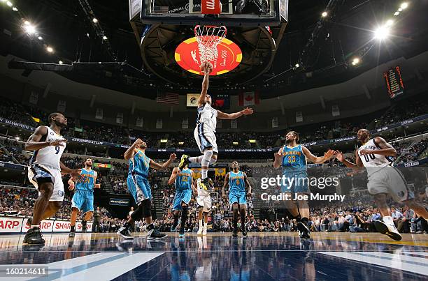 Jerryd Bayless of the Memphis Grizzlies shoots layup against Ryan Anderson of the New Orleans Hornets on January 27, 2013 at FedExForum in Memphis,...