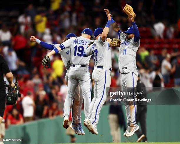 Bobby Witt Jr. #7, Michael Massey, Matt Beaty and Maikel Garcia of the Kansas City Royals celebrate with chest bumps after the victory against the...