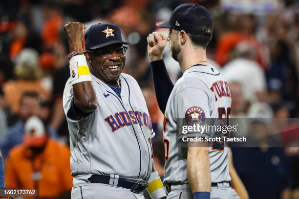 Manager Dusty Baker Jr. #12 of the Houston Astros celebrates with Kyle Tucker after the game against the Baltimore Orioles at Oriole Park at Camden...