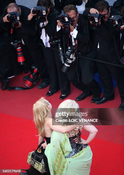 Actress Julie Atlas Muz and actress Dirty Martini arrive for the closing ceremony at the 63rd Cannes Film Festival on May 23, 2010 in Cannes. AFP...