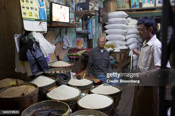 Baskets of rice stand at a store in Pathein, Myanmar, on Thursday, Jan. 17, 2013. Myanmar cleared about $1 billion in overdue debt with the Asian...