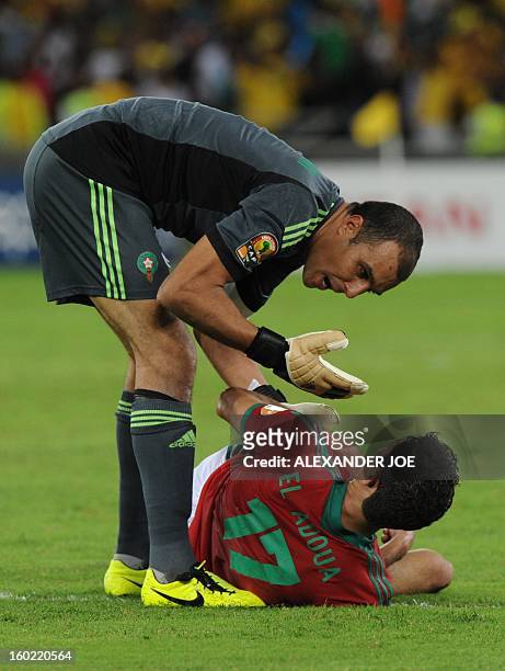 Morocco's goalkeeper Nadir Lamyaghri speaks with his teammate Issam El Adoua during the South Africa vs Morocco Africa Cup of Nations 2013 group A...