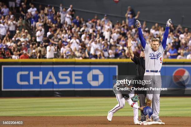 Freddie Freeman of the Los Angeles Dodgers reacts after hitting a RBI double against the Arizona Diamondbacks during the fifth inning of the MLB game...