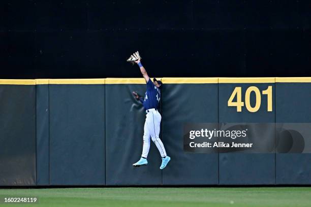 Julio Rodriguez of the Seattle Mariners makes a catch for an out during the fourth inning against the San Diego Padres at T-Mobile Park on August 08,...