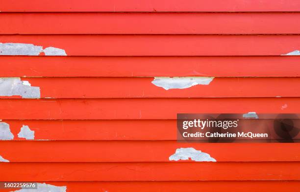 brick red wood siding with paint peeling - refurbished stock pictures, royalty-free photos & images