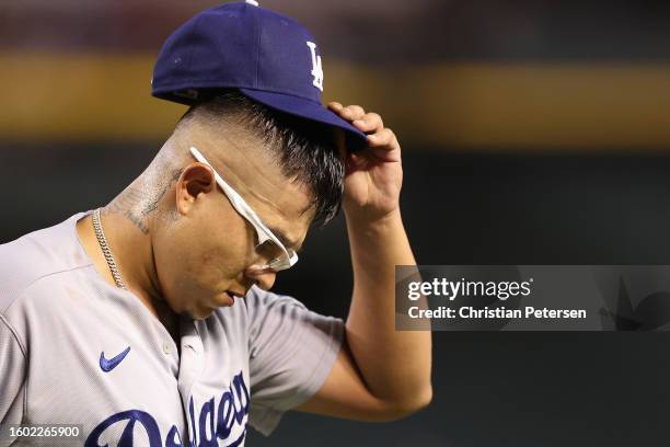 Starting pitcher Julio Urias of the Los Angeles Dodgers reacts after pitching out of the sixth inning of the MLB game against the Arizona...