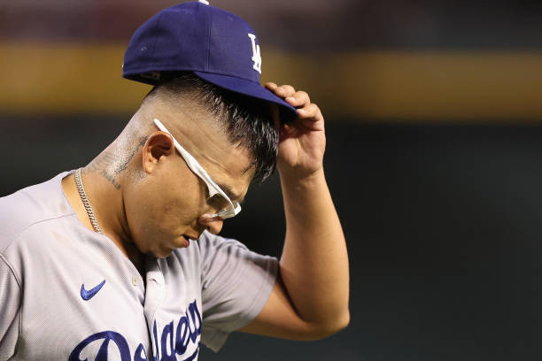 Starting pitcher Julio Urias of the Los Angeles Dodgers reacts after pitching out of the sixth inning of the MLB game against the Arizona...