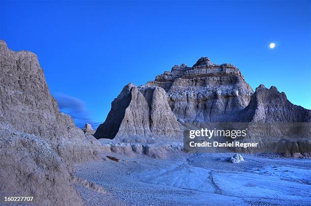 Long exposure night shot of the moon over the South Dakota Badlands. Unreal looking environment, it looks as if it could be somewhere on the moon.