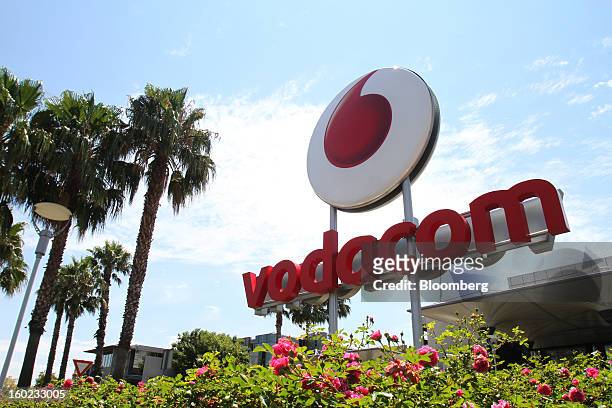 Logo stands outside Vodaworld, the headquarters of Vodacom Group Ltd., Vodafone's biggest African business, in Johannesburg, South Africa, on Monday,...