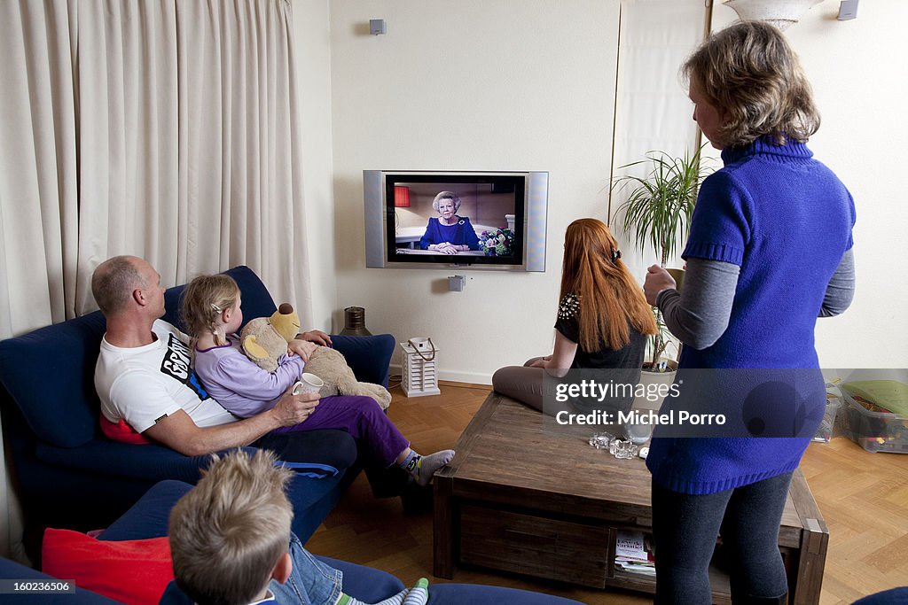 A Family Watches An Announcement By Queen Beatrix Of The Netherlands