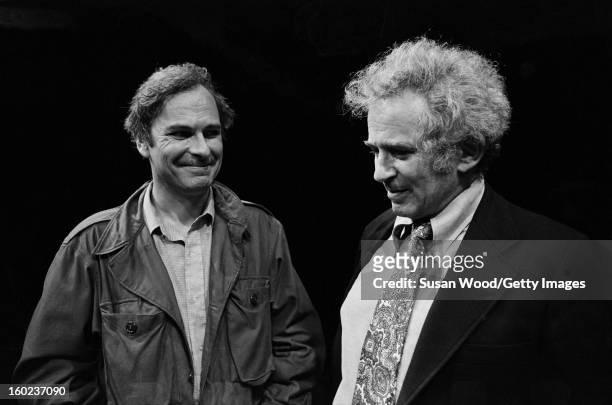American actor Rip Torn talks with author Norman Mailer during the latter's visit the set of Gelber's production of the play 'The Kitchen' at the...