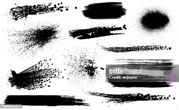 black grunge spray paint and brush strokes background - spraying stock illustrations