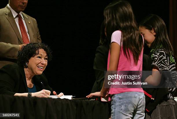Supreme Court Associate Justice Sonia Sotomayor signs copies of her book during a Commonwealth Club of California event at Herbst Theatre on January...
