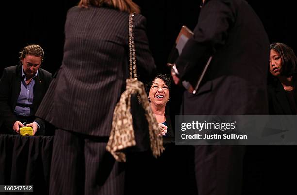 Supreme Court Associate Justice Sonia Sotomayor signs copies of her book during a Commonwealth Club of California event at Herbst Theatre on January...