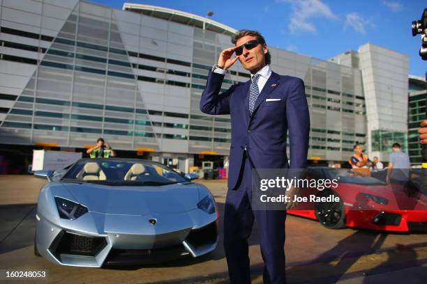 The President and CEO of Lamborghini Stephan Winkelmann stands near the new Lamborghini Aventador LP700-4 Roadster at the Miami International Airport...