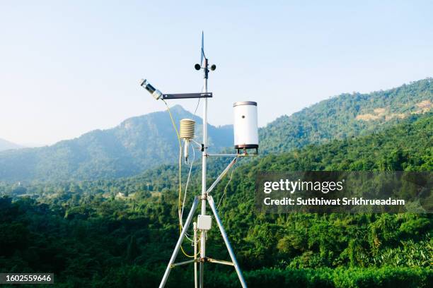 weather station against sky and mountain background - weather station stock pictures, royalty-free photos & images