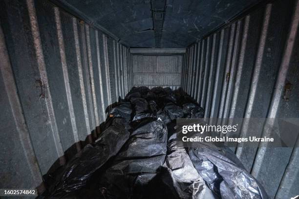 Corpses of Russian soldiers in black body bags who died in Kupiansk lie in the refrigerated van on April 4, 2023 in Kharkiv, Ukraine. Kupiansk was...