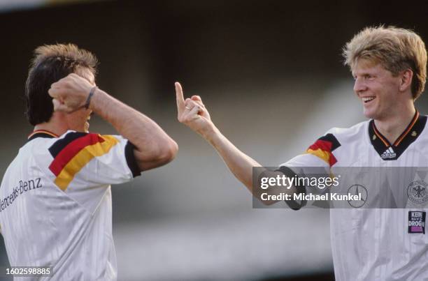 German footballers Jurgen Kohler and his teammate Stefan Effenberg during a training session ahead of the international friendly between Germany and...