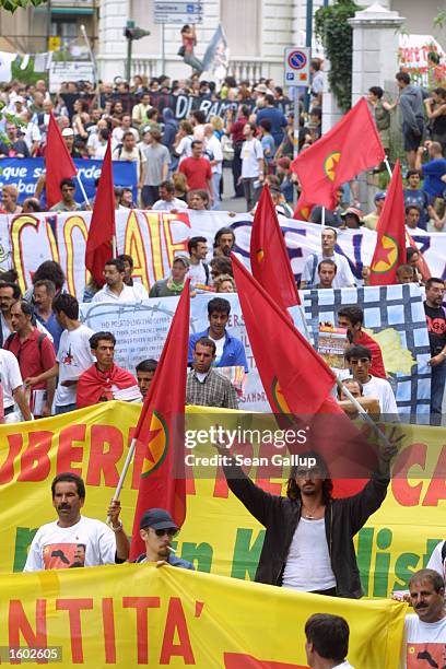 An estimated 30,000 anti-globalization demonstrators march July 19, 2001 in Genoa, Italy on the eve of the G8 summit. Although the march was...