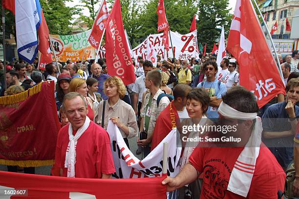 Some of an estimated 30,000 anti-globalization demonstrators march July 19, 2001 in Genoa, Italy on the eve of the G8 summit. Although the march was...