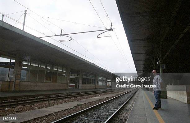 Train inspector stands on the platform of the Brignole Station, which closed at seven in morning as a way to help monitor travel into the city, July...