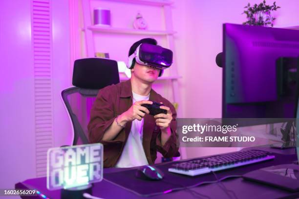 mastering the art of gaming - massively multiplayer online game stock pictures, royalty-free photos & images