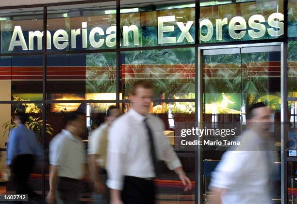 People walk in front of the American Express corporate headquarters July19, 2001 in New York City. The financial services company announced July 18...