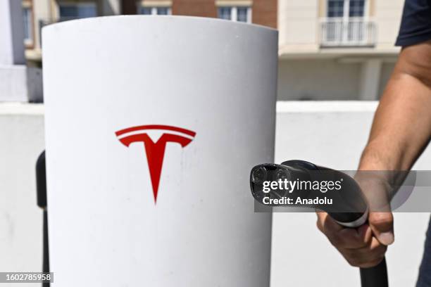 Tesla logo is seen on a charger station in Virginia, United States on August 16, 2023.