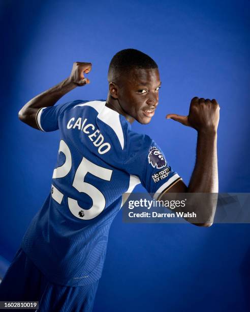 Moises Caicedo of Chelsea poses during his Media Day content capture photo session with the number 25 shirt at Chelsea Training Ground on August 16,...