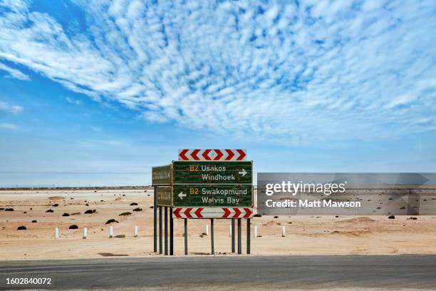 driving in the namibia desert landscape - heat haze car stock pictures, royalty-free photos & images
