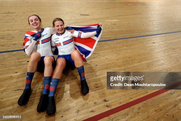 Gold medalists Neah Evans and Elinor Barker of Team Great Britain celebrate after winning the Women's Elite Track Madison at the 96th UCI Glasgow...