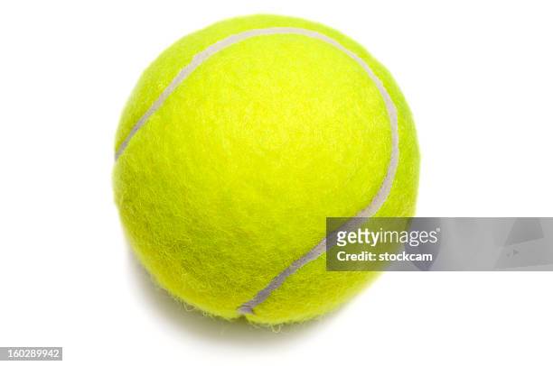 aislado amarillo bola de tenis - pelota fotografías e imágenes de stock